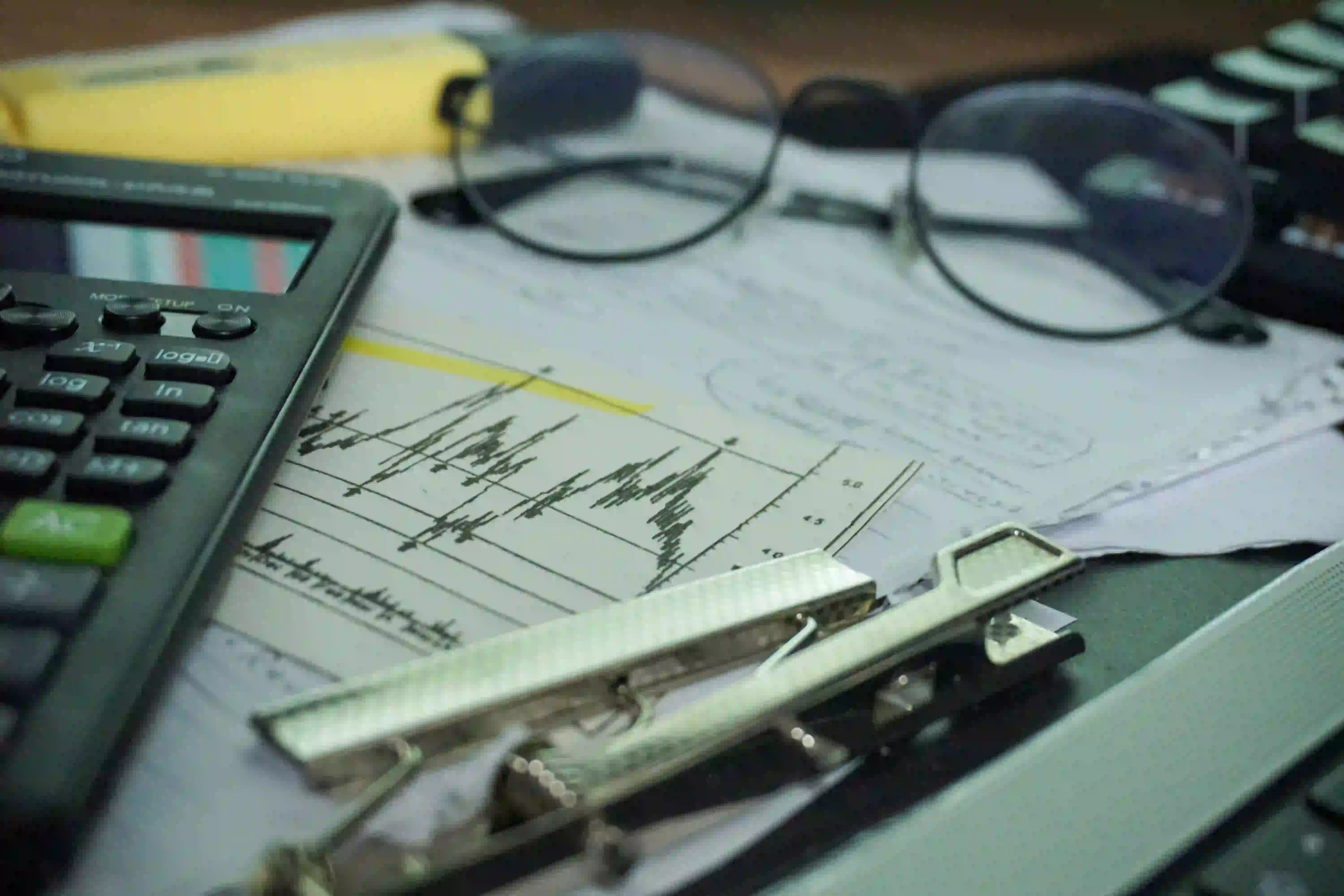 Person reviewing credit score information and financial records on a laptop
